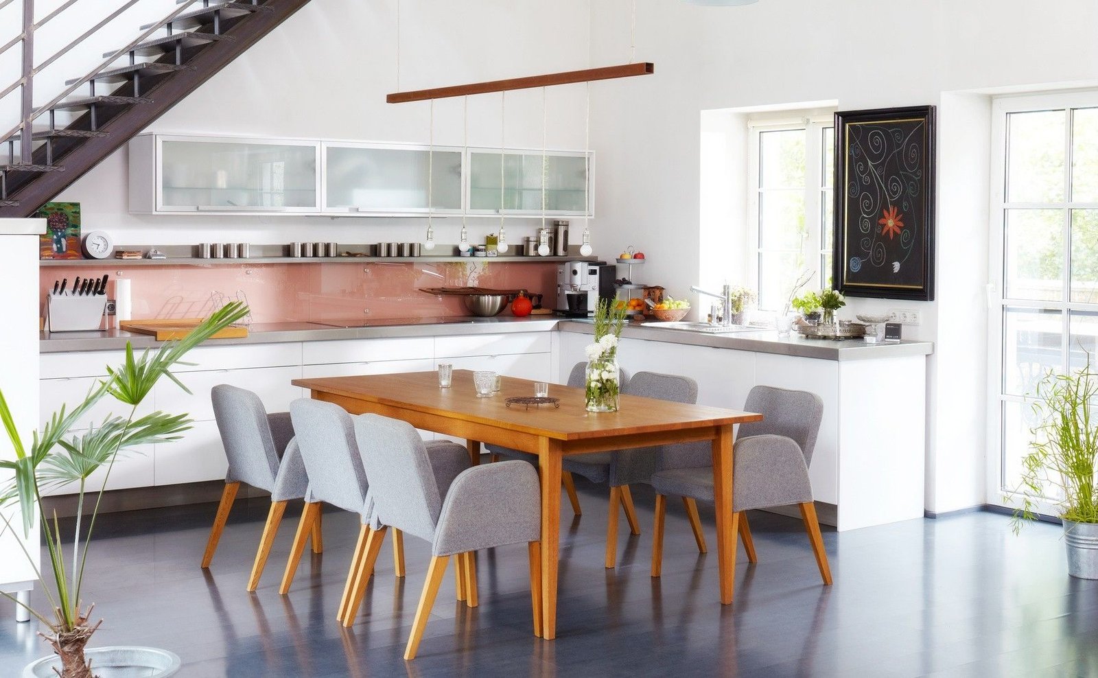 An open kitchen combines cooking and eating living and
